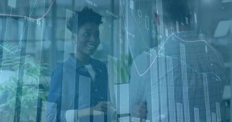 Image of financial data processing over diverse business people in office 写真素材