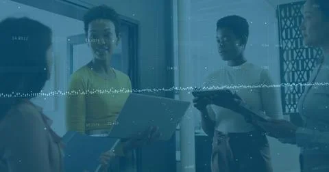 Image of financial data processing over diverse business people in office Foto stock