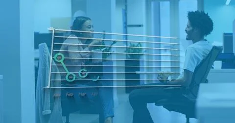 Image of financial data processing over diverse business people in office 스톡 사진