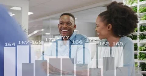 Image of financial data processing over diverse business people in office Stock Photos