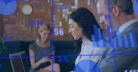 Image of financial data processing over diverse business people using laptop Stock Photos