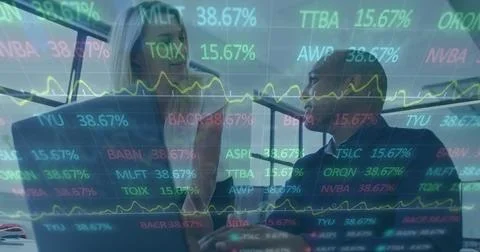 Image of financial data processing over diverse business people using laptop in Stock Photos