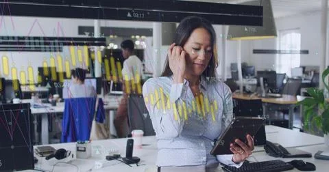 Image of financial data processing over asian businesswoman in office Stock Photos