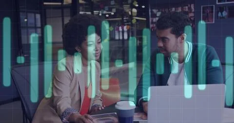 Image of financial data processing over diverse business people using laptop Stock Photos