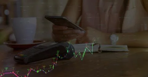 Image of financial data processing over caucasian woman paying with smartphone Stock Photos