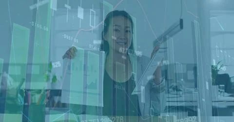 Image of financial data processing over asian businesswoman on image call Stock Photos