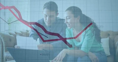 Image of financial data processing with red lines and statistics over caucasian Stock Photos