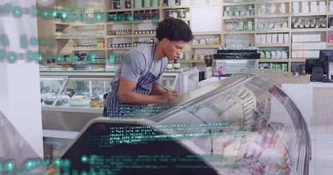 Image of financial data processing with red lines over man working in shop 写真素材