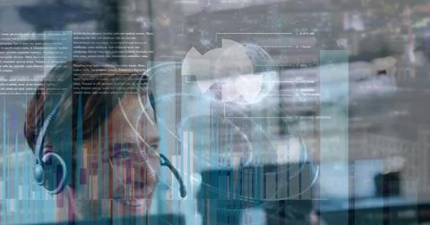 Image of financial graphs and data over happy caucasian male call center worker 스톡 사진