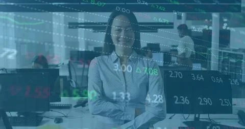 Image of financial graphs and data over happy asian woman in office Stock Photos