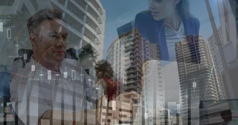 Image of financial graphs, data and cityscape over diverse businesspeople Stock Photos