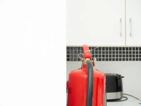 Image of fire extinguishers in the kitchen Stock Photos
