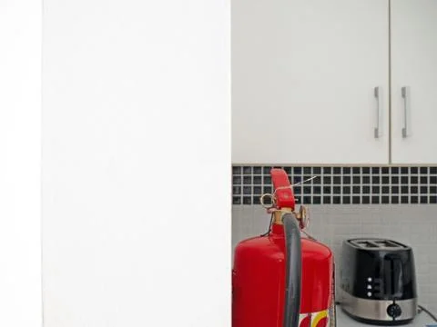 Image of fire extinguishers in the kitchen Stock Photos