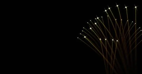Image of fireworks exploding over black background Illustrazione stock
