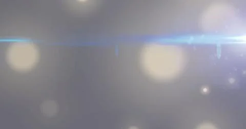 Image of flaring light beam moving over bokeh white light spots on grey Ilustração Stock