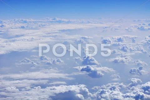 An image of a flight over the clouds Stock Photos