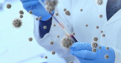 Image of floating macro Covid-19 cells over doctor taking sample and wearing Stock Photos