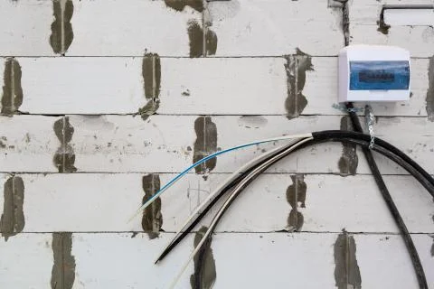 Image with focus view on the electrical power cables fixed on the wall made from Stock Photos