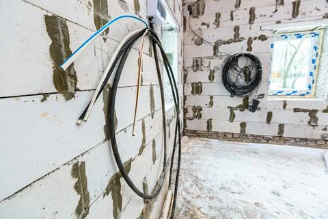 Image with focus view on the electrical power cables fixed on the wall made from Stock Photos