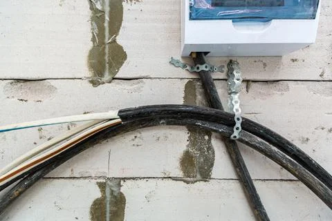 Image with focus view on the electrical power cables fixed on the wall made from Stock Photos