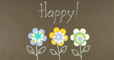 Image frame background of blooming paper flowers on a colored background. Stock Photos