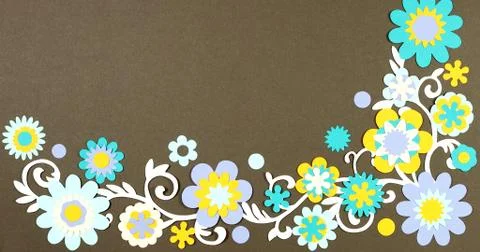 Image frame background of blooming paper flowers on a colored background. Stock Photos