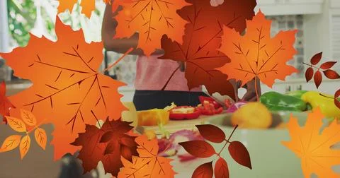 Image of frame with fall leaves over african american woman cutting vegetables Stock Illustration