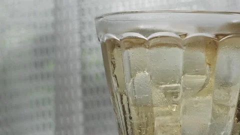 Image of ginger ale on a table by the window Stock Footage 285280667