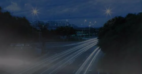 Image of globe and financial graphs over night road Ilustração Stock