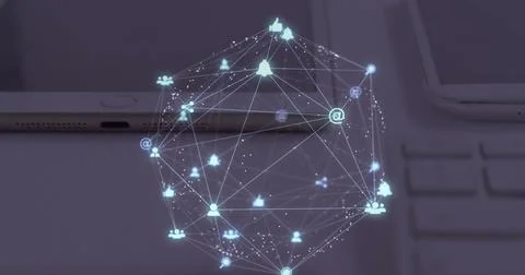 Image of globe of digital icons spinning over close up of laptop, diary and Stock Illustration