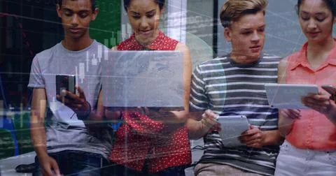 Image of globe, graphs and codes over multiracial students discussing while Stock Photos