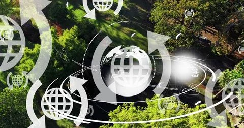 Image of globe icons with arrows and globe spinning over landscape Stock Illustration