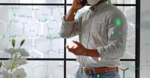 Image of globe with network and icons over african american businessman using Foto stock