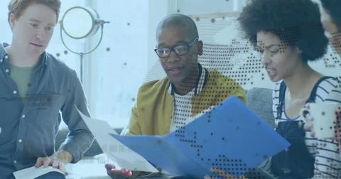 Image of globe over diverse business people in office Stock Photos