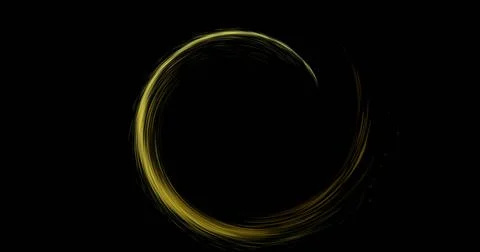 Image of glowing circle of yellow light trial with copy space on black back.. Fotos Stock