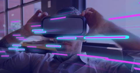 Image of glowing light trails of data transfer over caucasian man in vr headset Stock Photos