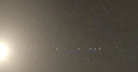 Image of glowing spots of lights over dark background Ilustração Stock