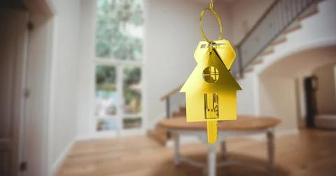 Image of gold key and key ring over blurred house interior Stock Photos