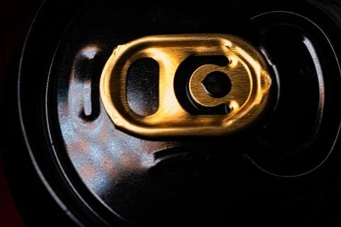 An image of a golden pull ring on a beer or soda can, representing the ease.. Stock Photos