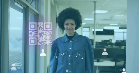 Image of gr code and icons over biracial woman smiling in office Stock Photos