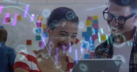 Image of graph and processing data over smiling caucasian male and female Stock Photos