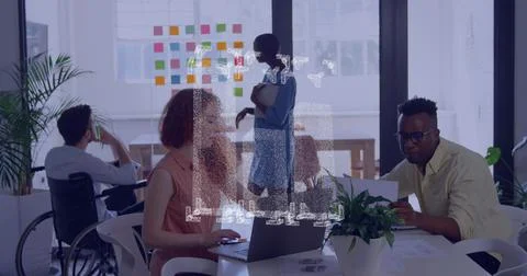 Image of graph icon spinning against diverse man and woman discussing over a Stock Photos