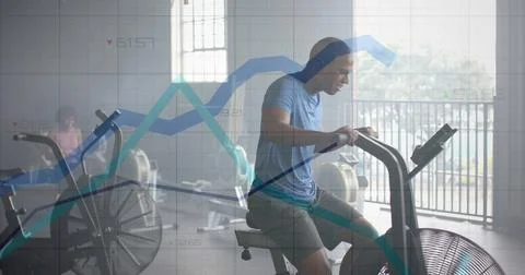 Image of graph processing data over caucasian man cross training on elliptical Stock Photos