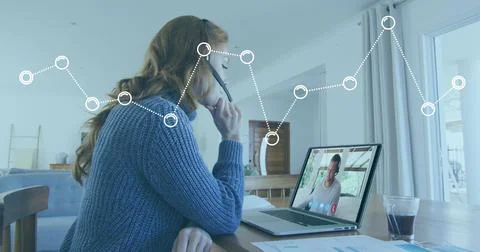 Image of graph processing data over caucasian woman at home making laptop image 스톡 사진