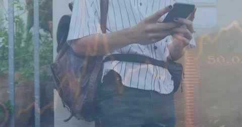 Image of graphs and up arrows over biracial man with travel bag scrolling on Stock Photos