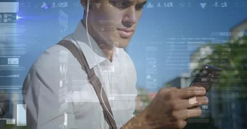 Image of graphs and data over biracial man using smartphone Foto stock