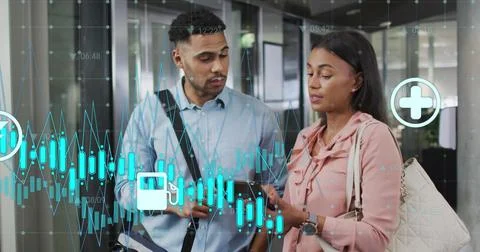 Image of graphs, changing numbers, icons, diverse coworkers discussing reports Stock Photos