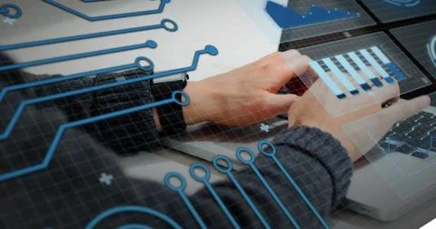 Image of graphs, circles and circuit board pattern over caucasian man working on Stock Photos