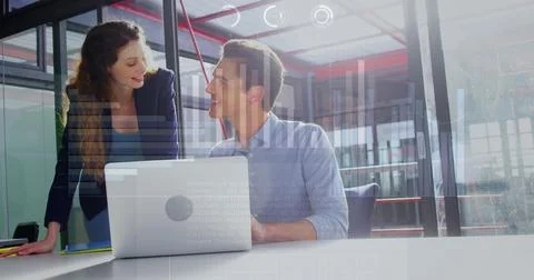 Image of graphs, loading circles and bars, caucasian coworkers sharing ideas in Stock Photos