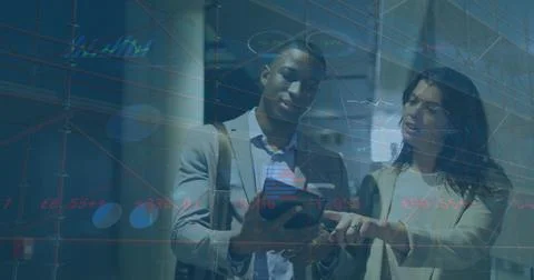 Image of graphs, trading board, loading diverse coworkers discussing while Foto stock